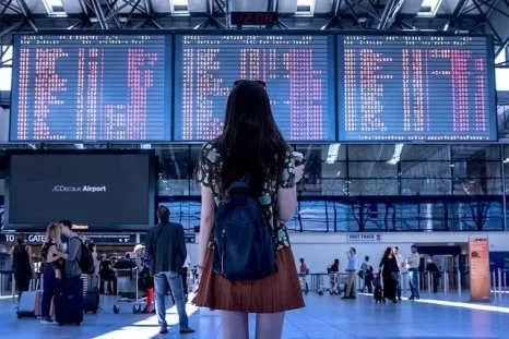 A staff traveling for work at an airport