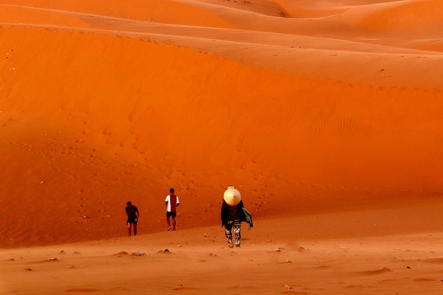 People visiting red dunes in Dubai desert safari
