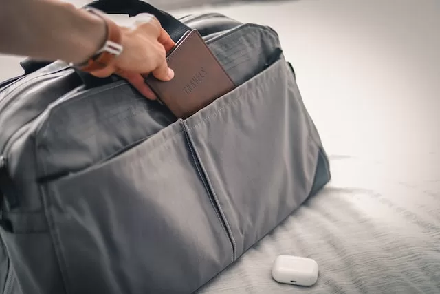 travel essentials for men packed in a suitcase